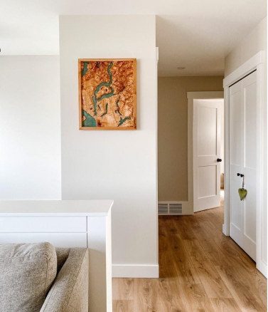 Wooden Powell Lake Map hanging up in a room